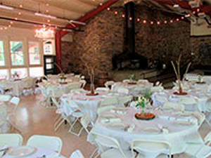 picture of tables decorated with white tablecloths at burke lodge 