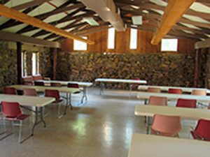 picture of river radio with tables and chairs set up in sandstone building 