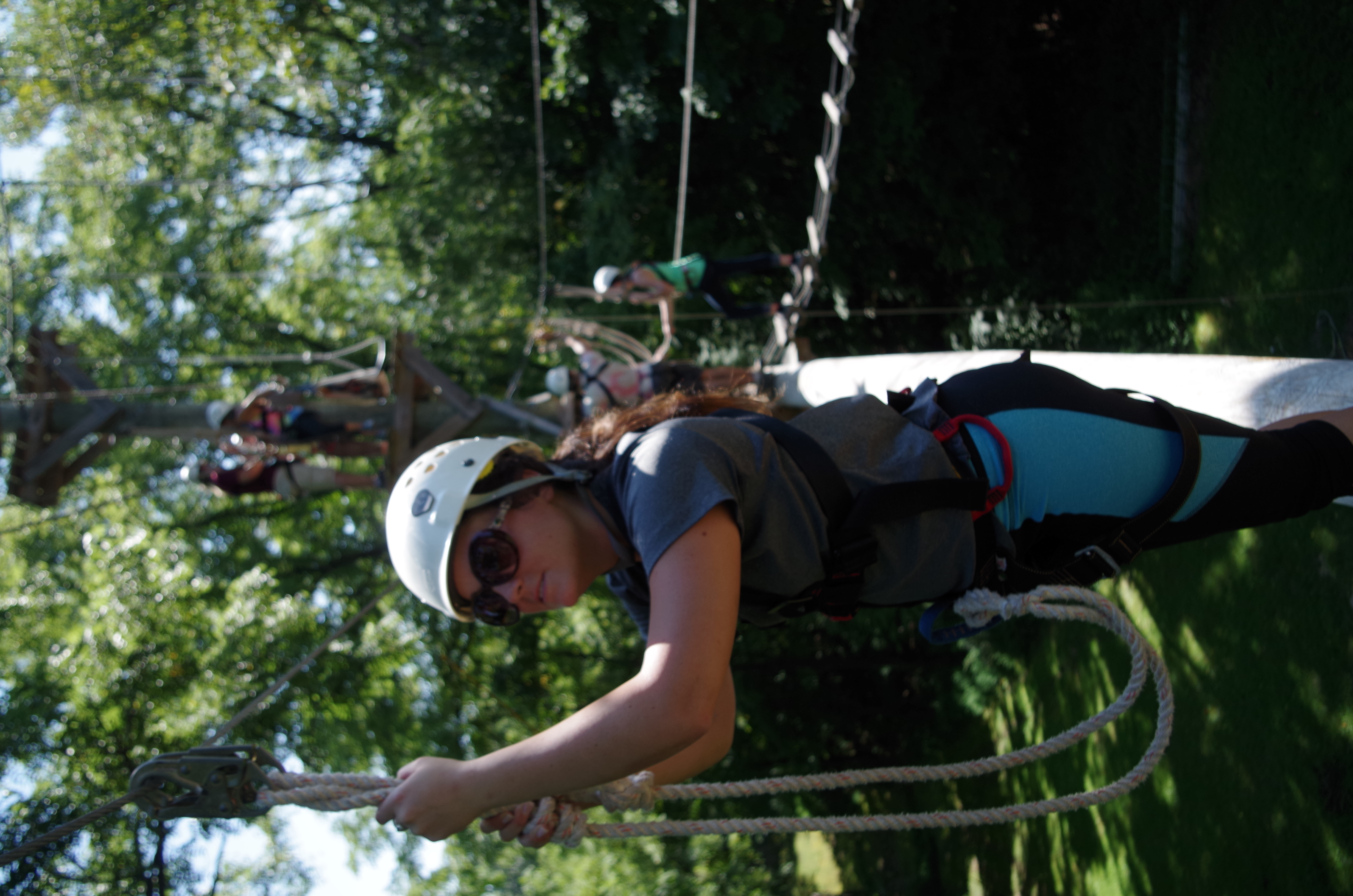 college students on a high ropes course.