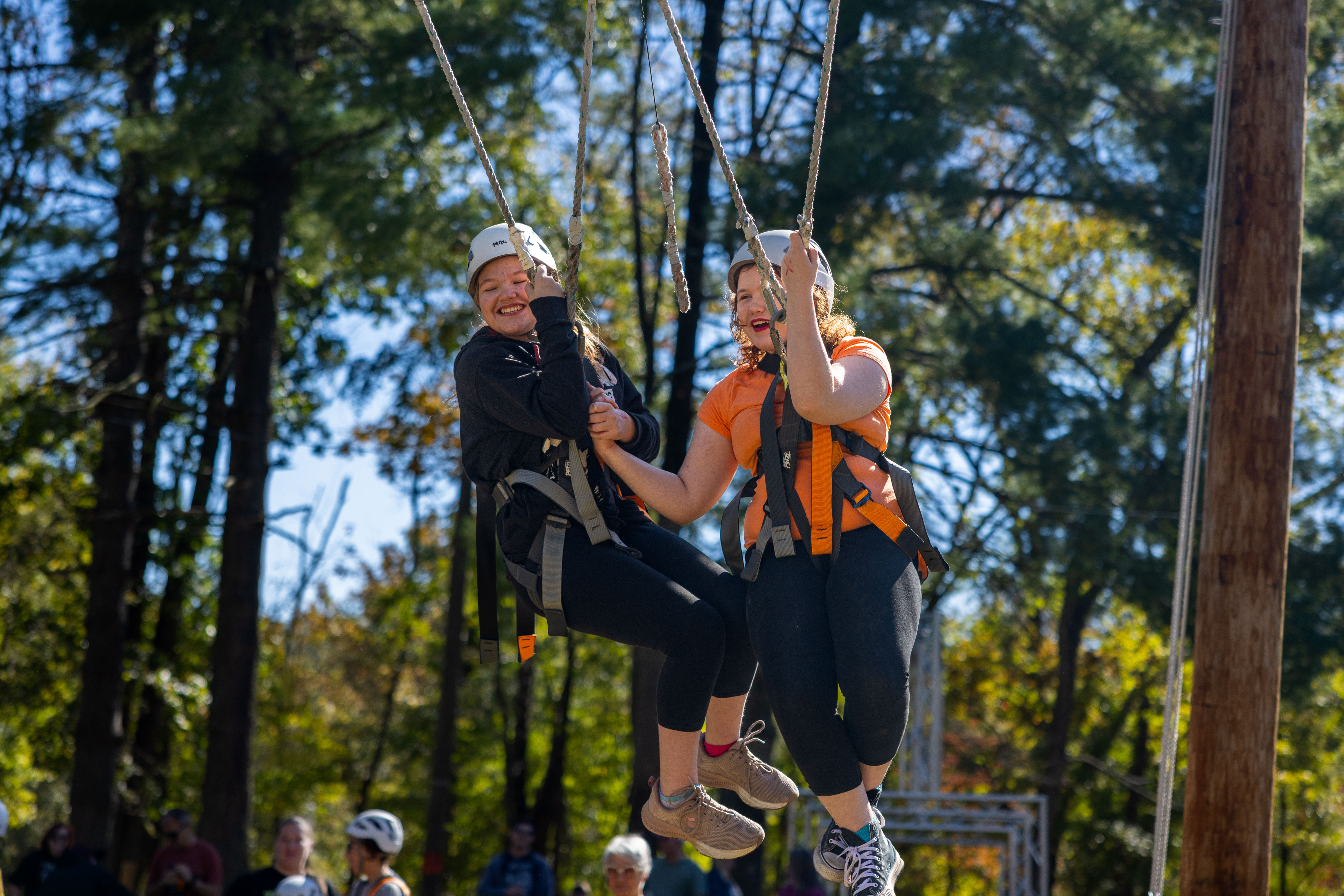 Two young girls swing on the Giant Swing.