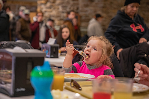 Girl eating pancakes