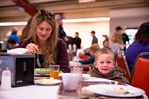 Adult and child at the Pancake Breakfast