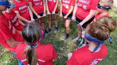 people in a circle wearing red