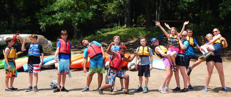 picture of kids wearing life jackets at partner camp