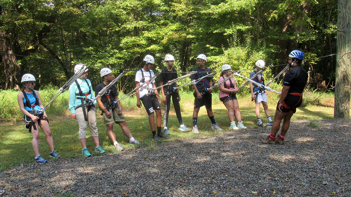 group of campers ziplining 