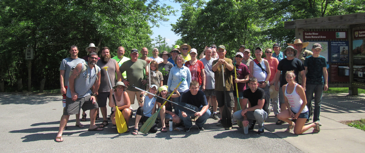 group of people holding oars 